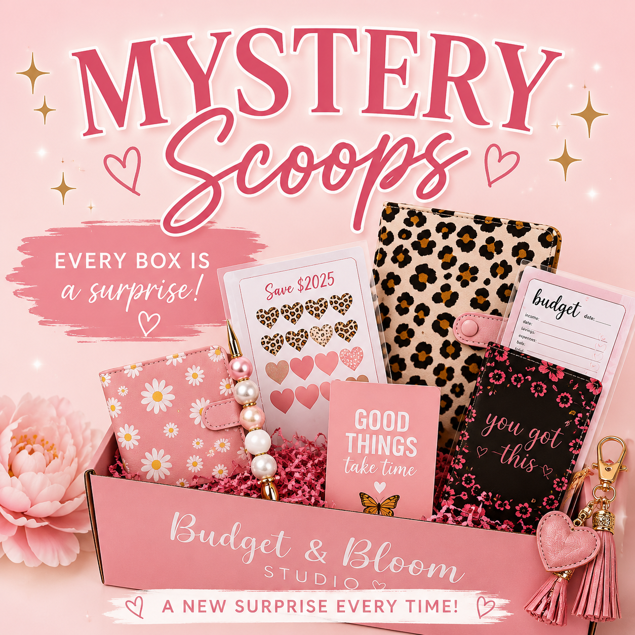 This is a picture of Binders  and savings trackers in a pink box. with pens and stickers 
