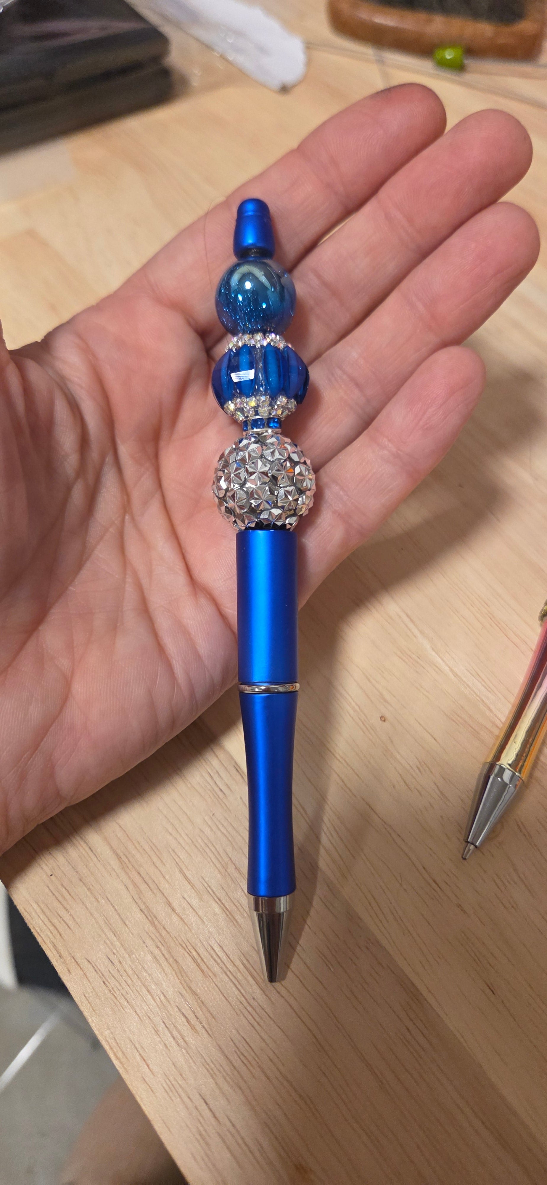 Royal blue metallic beaded pen with rhinestone focal bead