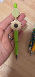 Green beaded pen with sunflower and leaf focal bead